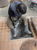 ハツリ作業中「コンクリートの排水マス直せます！　右京区　西京極　水道　ミヅケンジャー」