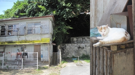 広い路地をまっすぐ進むと広場に到着。戦後すぐに立てられた古めかしい白塗りの木造アパートがあるんですが、近所にお住まいの方いわく、旅行者が宿泊できる（できた）とか。アパートの背後の緑地帯には大きなお墓がたくさん。ここ一帯だけ時間がゆっくり流れています。