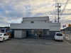 店舗はコメリさん入口付近「本店移転いたしました」
