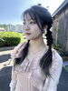 パーティヘア「屋外で映える！グリーンカラーの三つ編みヘアアレンジ」