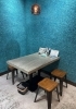テーブル席を2つご用意しております「バリアフリーで安心！青い壁が印象的なテーブル席で快適なお食事を」