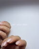 洗練されたハンドケアで自爪を美しく「60代のお客様ネイル：淡いピンク×シルバーラインの上品デザイン」