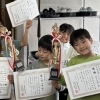  6年生の卒業祝い、そろばんの地区大会に