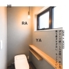 施工事例｜グレー×木のトイレ空間