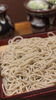 つるっと滑らか、匠の蕎麦}, ({「蕎」の音で, )「外壁塗装工事中も通常営業しています」
