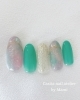 キラキラ輝く海辺のようなデザイン「    ミントカラーが主役の大人可愛いネイル💅」