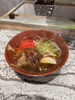 琥珀色のスープとじっくり煮込んだソーキ「琉球そばと玖二郎」