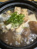 「滋味あふれる出汁と香ばしい焼きねぎ、心まで温まる熱々のスッポン丸鍋」