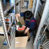 引っ越し業者さんによる箱詰め作業が始まりました。「新図書館への道のり⑫」