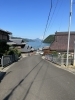 舞鶴湾をはさんで、遠くに青葉山「ある日の配達風景」