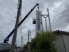 新看板を取り付ける様子「国府印刷社-看板修理工事」