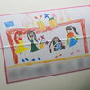 子どもの絵を生コン車ドラムに