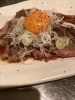 自家製タレとお肉・卵黄のハーモニー「【1周年イベント残り2日】宝焼酎ボトル1,000円は明日まで」