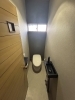 洗練されたデザインのレストルーム「トイレ空間のリフォーム事例｜明るく使いやすいレストルームへ」