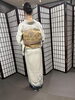 「問屋町レンタル着物TUZUMI　淡いクリーム色の訪問着と華やかな帯で彩る、上品な和装コーディネート」