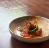 自家製ハーブをたっぷり使った煮込み料理「仔羊と白いんげん豆のトマト煮込み🍅　農家イタリアン trattoria＆bar 黒猫🐈‍⬛」