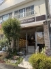 シンプルなお店のロゴが目印。「trunk optique（トランク オプティーク）」