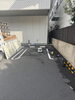 施工前「駐車スペースを有効活用！屋根付き物置・駐輪場へのリフォーム施工事例」