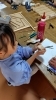 制作中、丸く切った2枚の板を合わせてます。「出来上がりのこまと迷路」