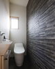 「木のぬくもりを感じる玄関🏠【《天然板》×《ガルバリウム鋼板》を使った完全オーダーメイドの家づくり　注文住宅なら『清水住建』】」