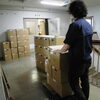 箱詰めした箱が積み上がっています。「新図書館への道のり⑫」