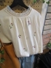 上品な刺繍柄がおしゃれなトップス「小花刺繡チュニック×綿麻カーゴで初夏のナチュラルカジュアル」